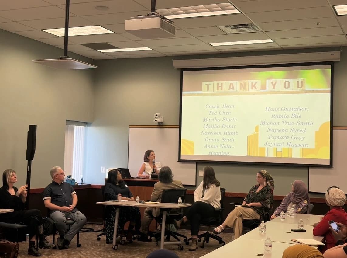 Naomi Peters speaking to an audience at an Inspired Generosity interfaith panel
