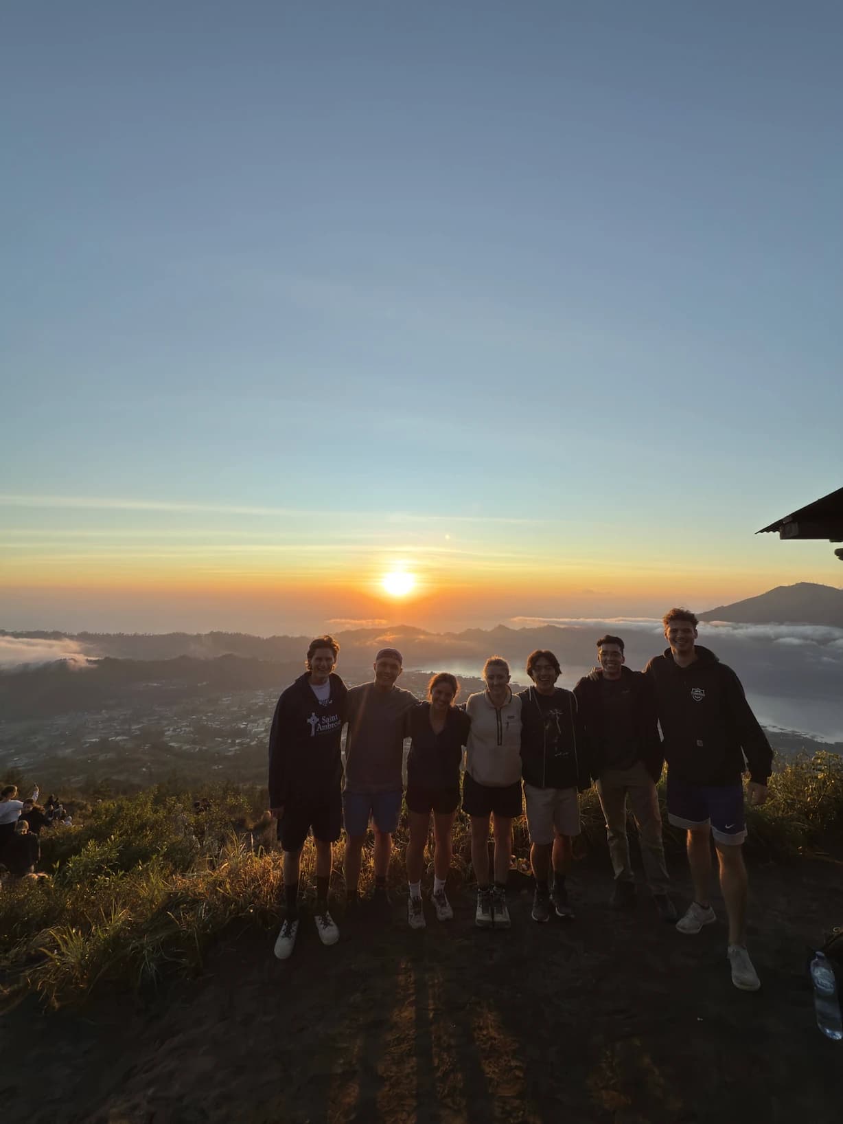 Friends at sunrise on the summit of Mount Batur